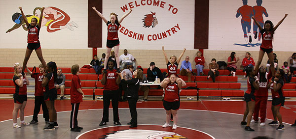 The 2017-2018 Cheer Team Perfoms a Stunt at a Pep Rally