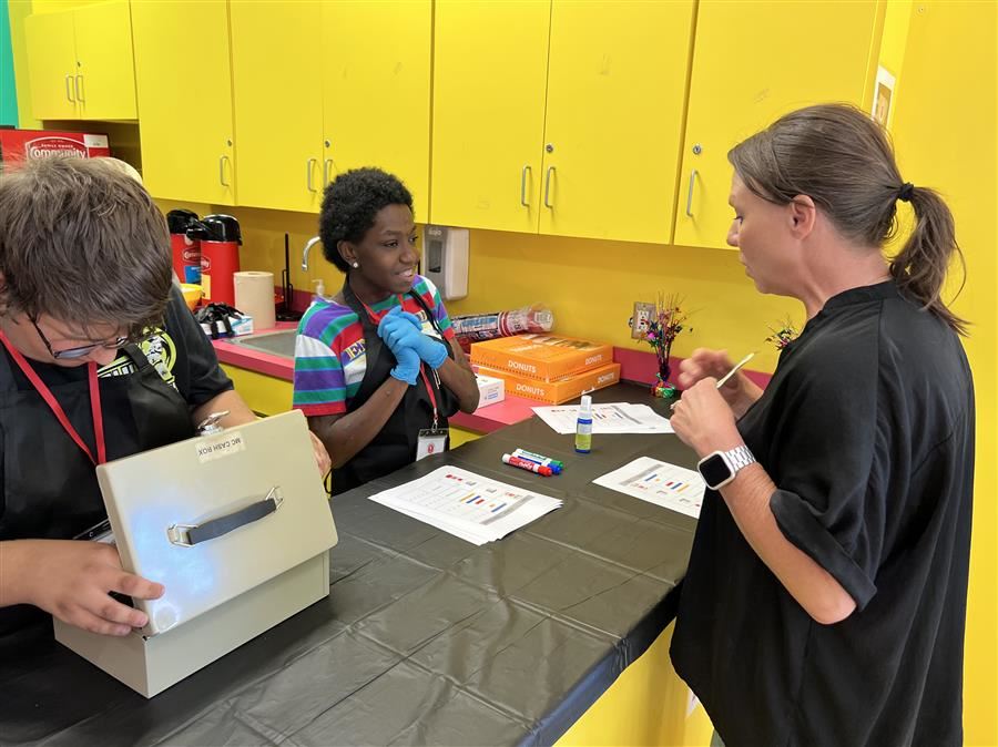   Helen Keller School of Alabama Principal Jeanna Chandler places her coffee order at Wake Up Café.