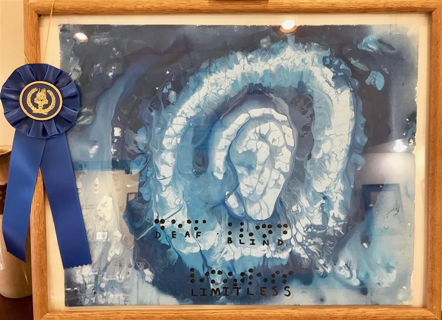  painting of human ear in blue and white, with braille saying, "Deaf. Blind, Limitless"