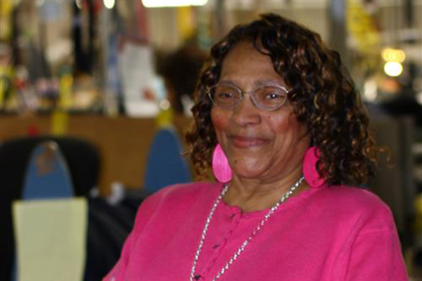 AIB employee Rushie Cochran sits in a chair