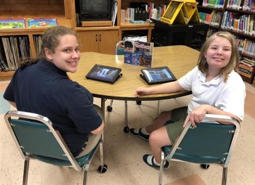 two reading students 