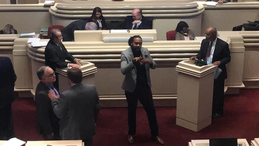 Matt interpreting on the house floor in the capital