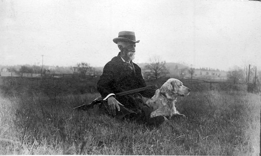 Elderly Seaborn Johnson with his dog 