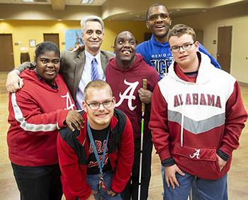 AIDB President Dr. John Mascia with five happy Helen Keller School students 