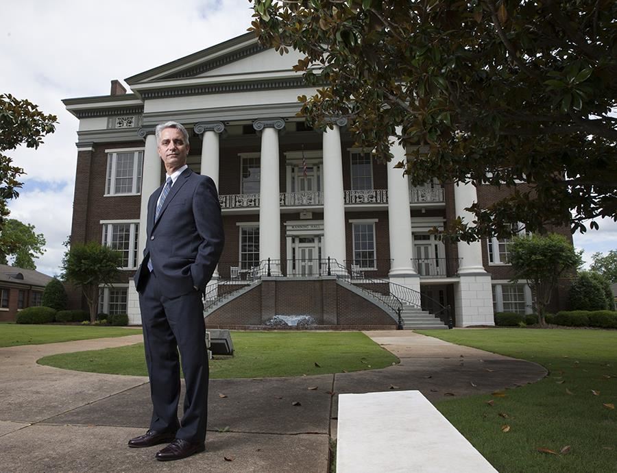 AIDB President Dr. John Mascia stands in front of Manning Hall 
