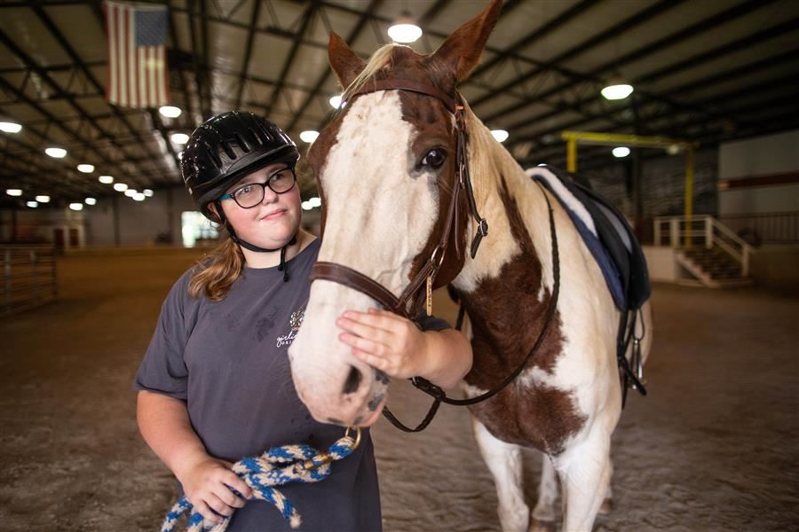 student with horse