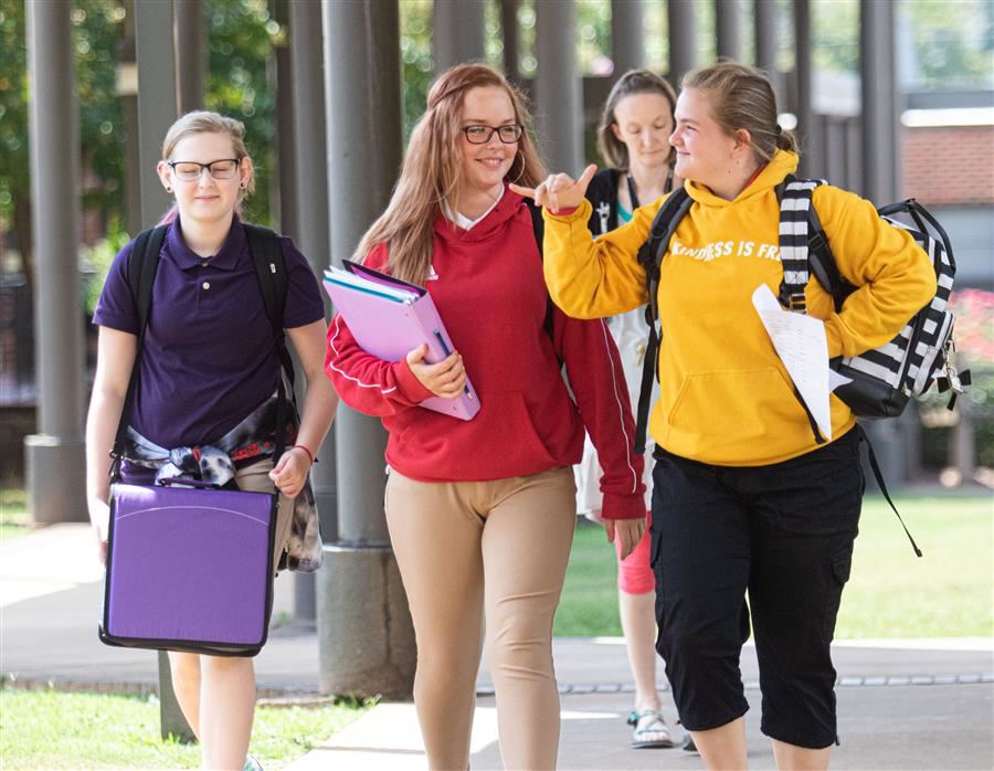 3 students walking