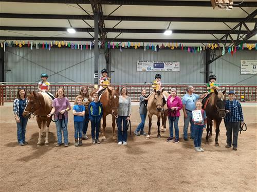 Students from the ASD Listening and Spoken Language Program pose for a photo with their volunteers 