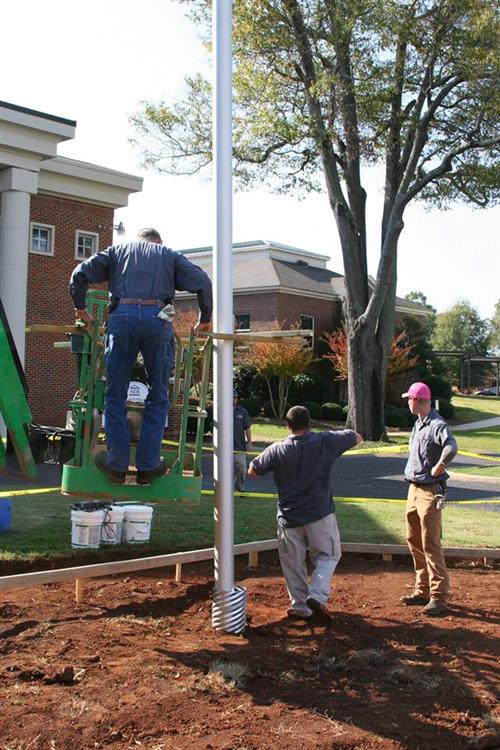 Maintenance man stepping of a man lift 