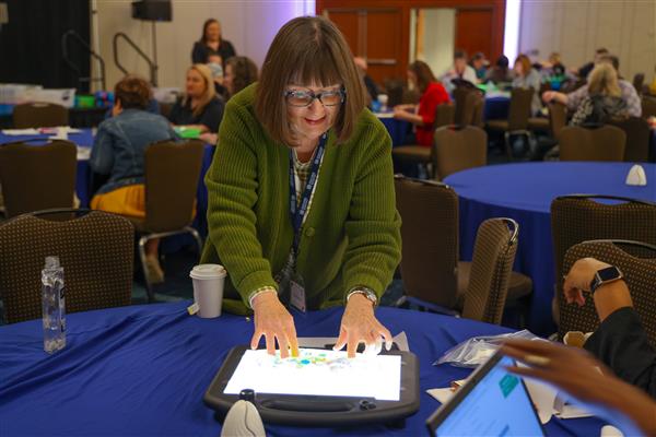 TVI attending DBL 2023 conference uses the lightbox for an activity